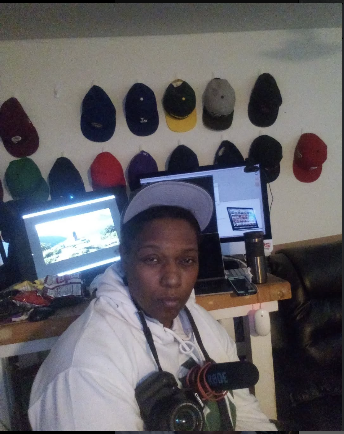 Kiana Kai with caps and camera